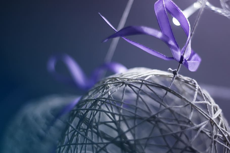shallow focus photo of purple ribbon, craft, textile, design