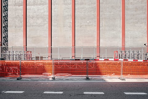 concrete road near building, photo of gray metal railings near road during daytime HD wallpaper