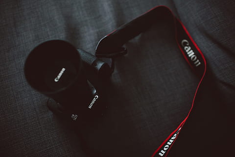 black Canon EOS DSLR camera on gray textile, black Canon DSLR camera on gray textile HD wallpaper