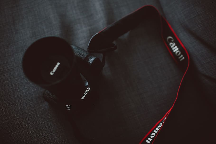 black Canon EOS DSLR camera on gray textile, black Canon DSLR camera on gray textile HD wallpaper