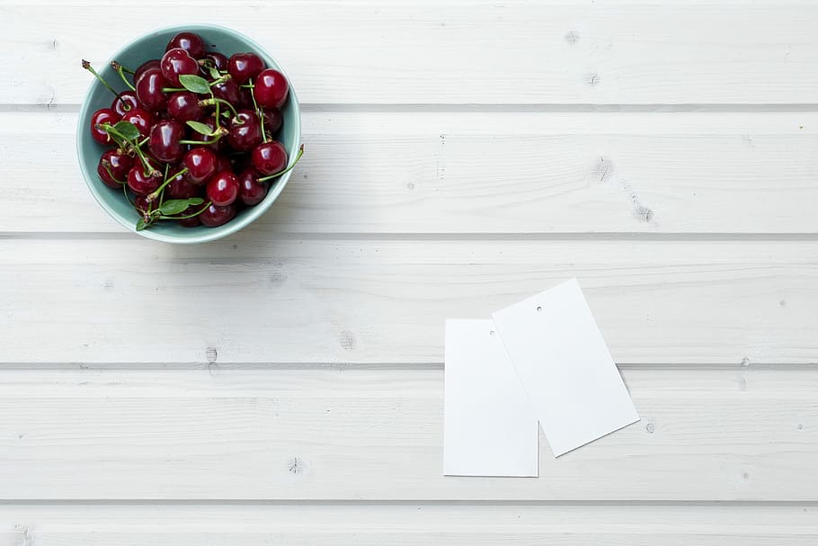 cherries in bowl beside paper, cherries in blue plastic bowl HD wallpaper