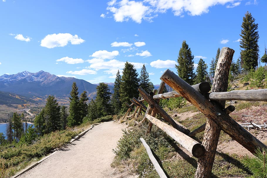 photo of pathway near body of water and mountain, autumn, fall