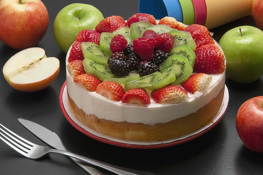 round cake with assorted fruits on top, strawberry cake on table near fruits HD wallpaper