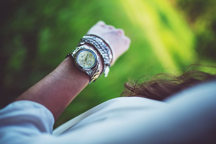 woman wearing round chronograph watch with silver-colored link bracelet HD wallpaper