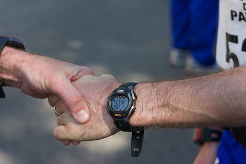 two person shaking hands, person touching person's hand wearing watch HD wallpaper