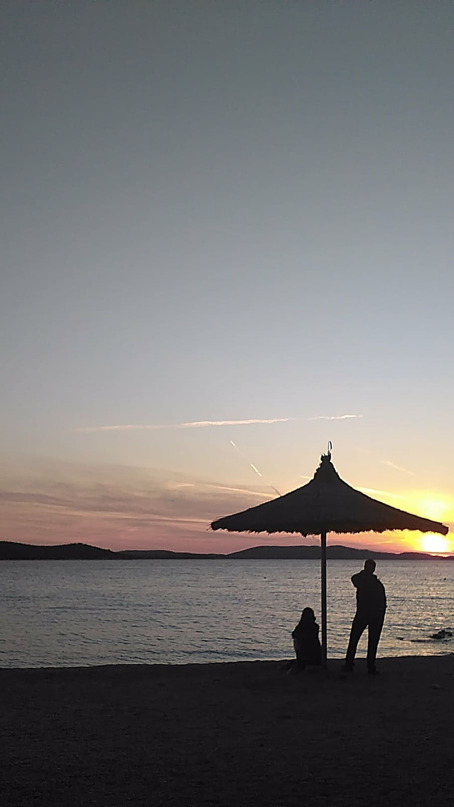 sunset, beach, water, sea, people, vacations, silhouette, nature HD wallpaper