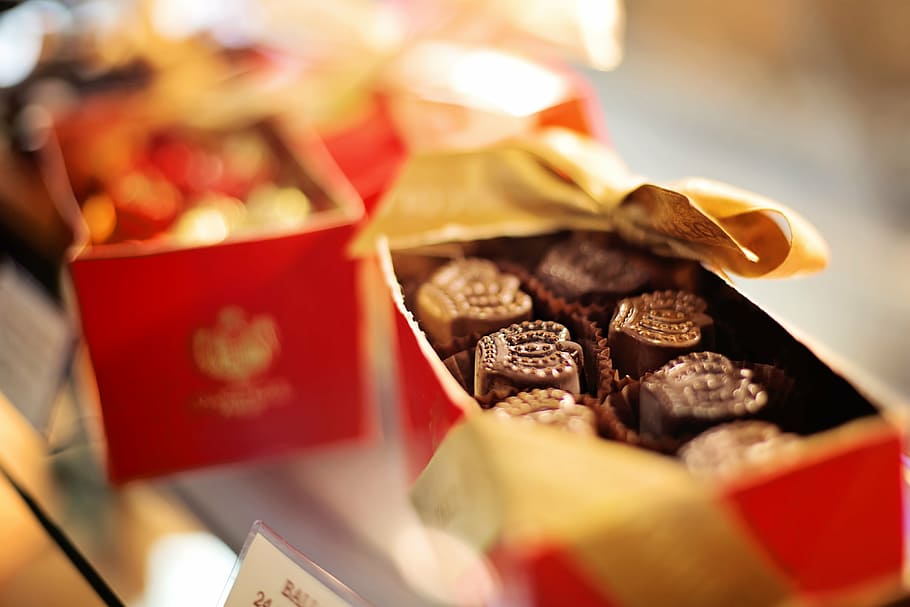shallow focus photography of yellow and red box, chocolates HD wallpaper