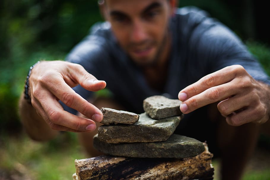 person holding gray rocks, building, zen, man, boy, pyramid HD wallpaper