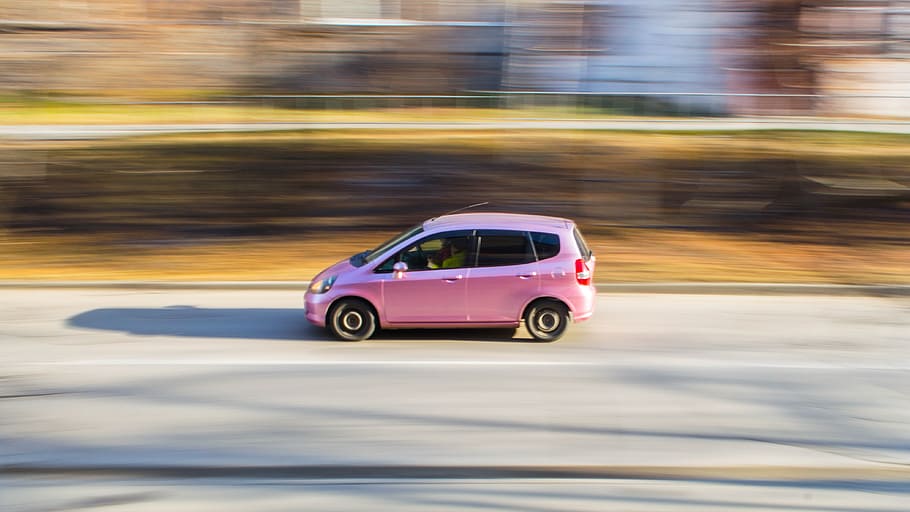 timelapse photography of pink Honda Fit 5-door hatchback on road HD wallpaper