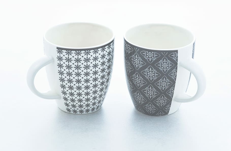 two white and black ceramic mugs on surface, cups, faded, bleached HD wallpaper