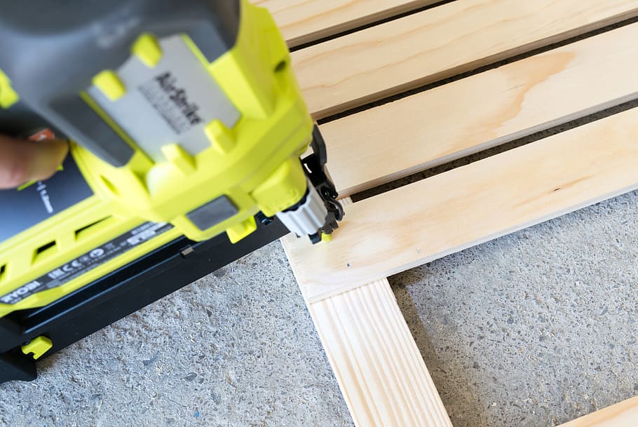 person holding yellow and black power tool, hardware, wood HD wallpaper