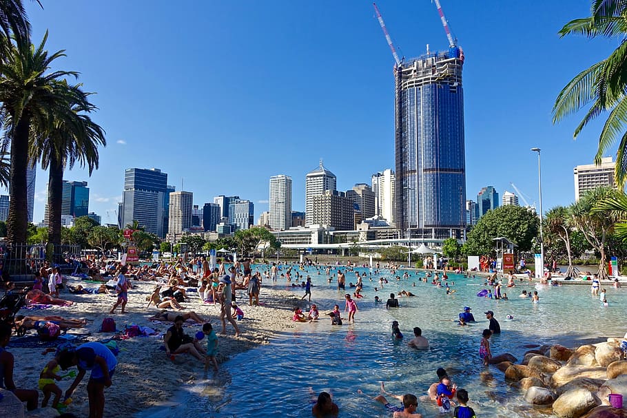 people swimming on beach near building, city, southbank, swimmers, HD wallpaper