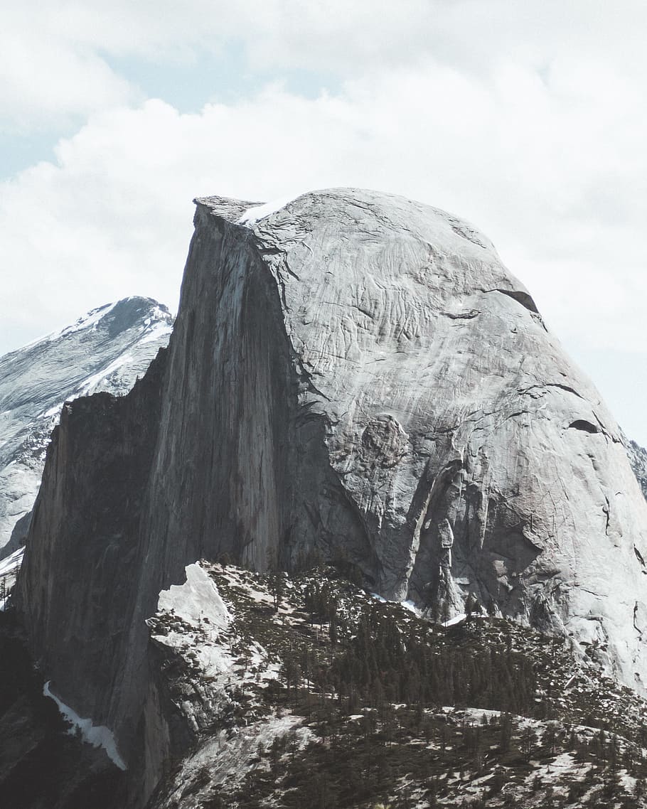 gray mountain, gray rugged mountain under white cloudy sky at daytime HD wallpaper