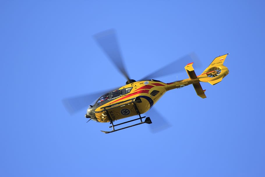 low angle photographed of flying yellow helicopter, medical HD wallpaper