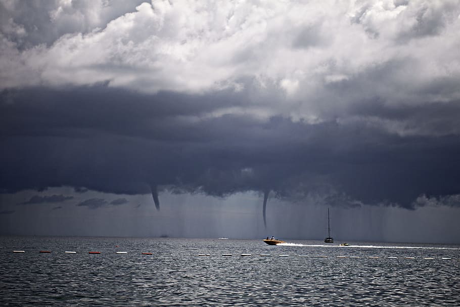 boat on sea under white clouds, photography of boat under cloudy sky HD wallpaper