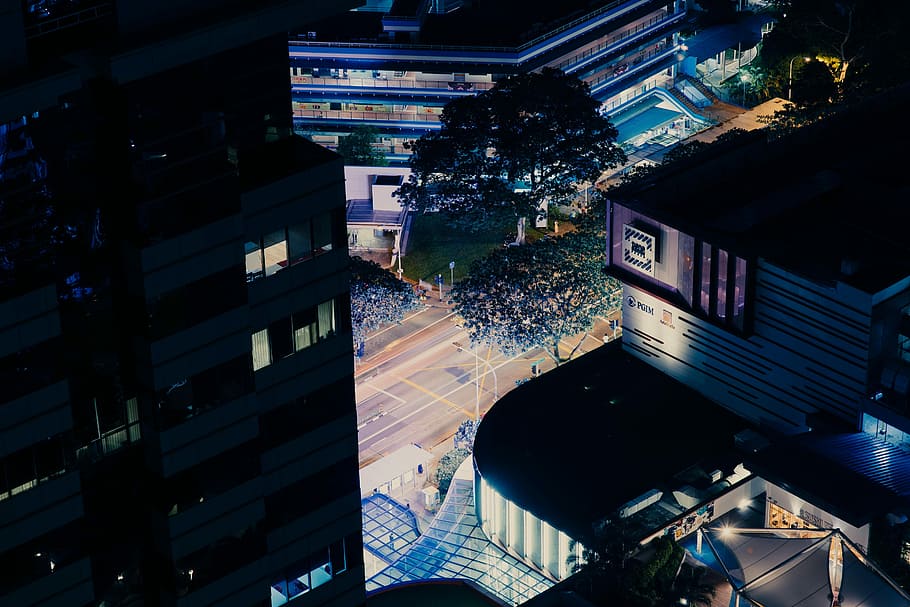 areal view of building at nighttime, high angle photo of building near trees and road HD wallpaper