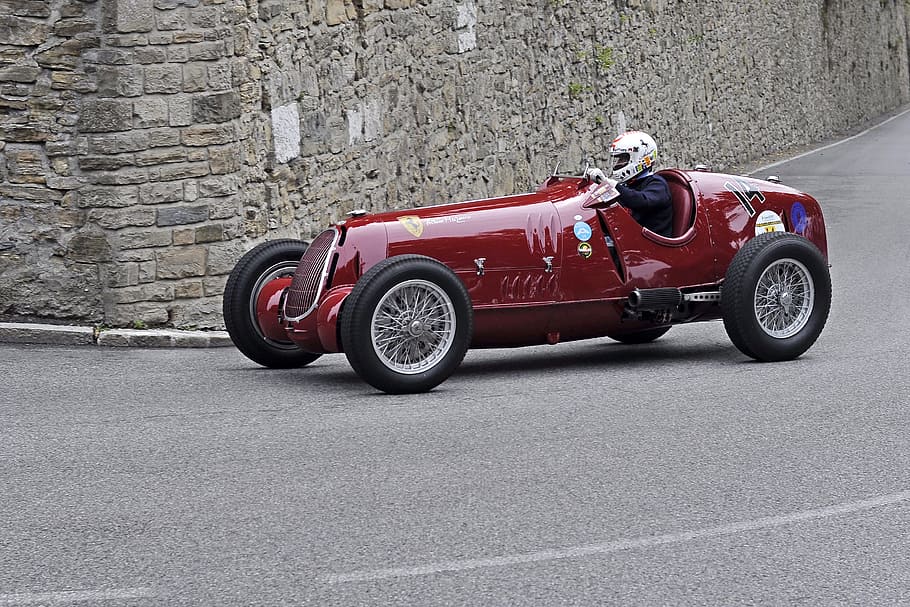 man riding red vintage racing car on road, Alfa Romeo 12C, Bergamo