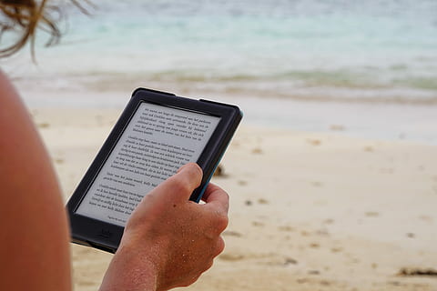 person holding black tablet computer during daytime, person reading on the black tablet computer HD wallpaper