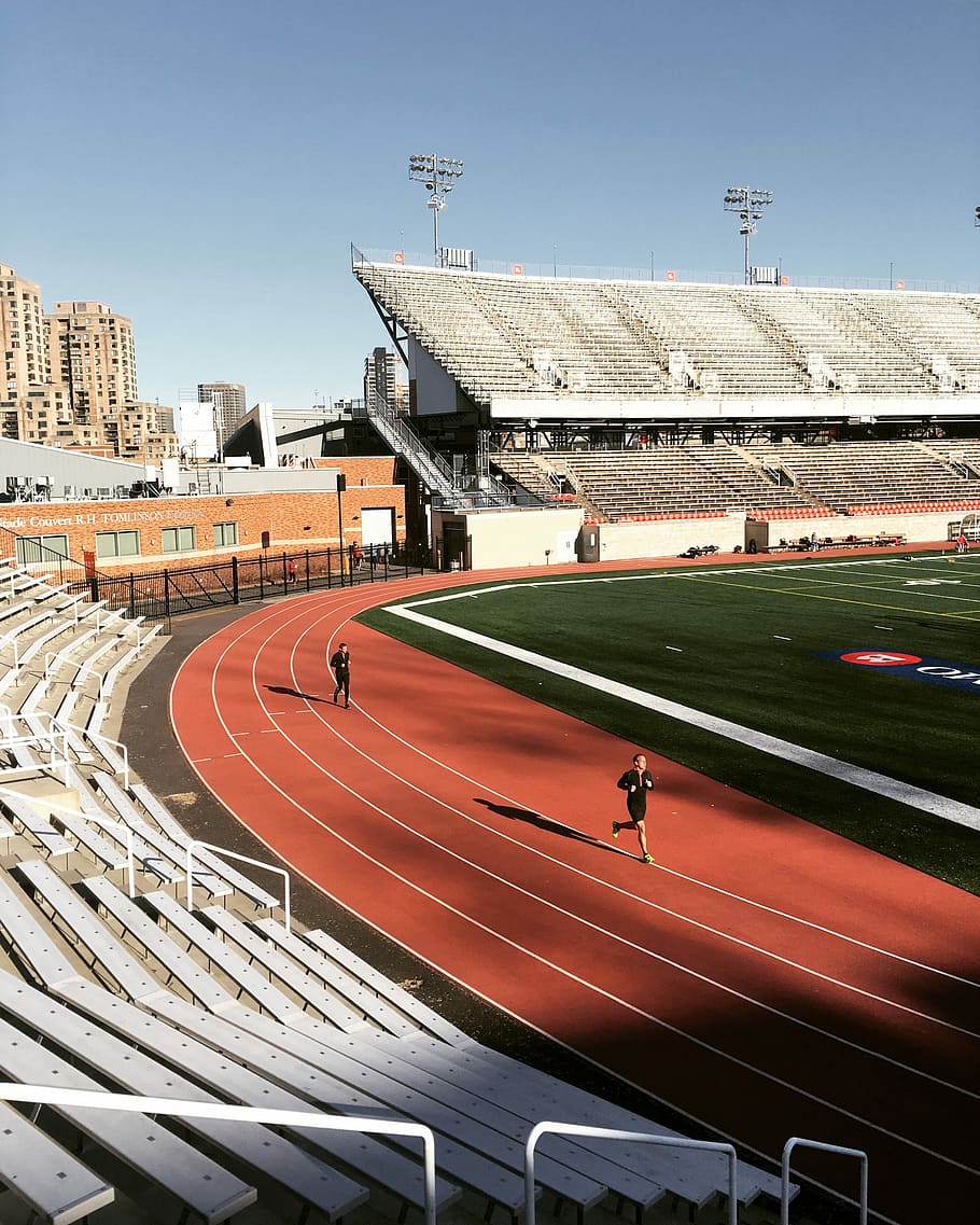 man running on track field during daytime, stadium, exercise HD wallpaper