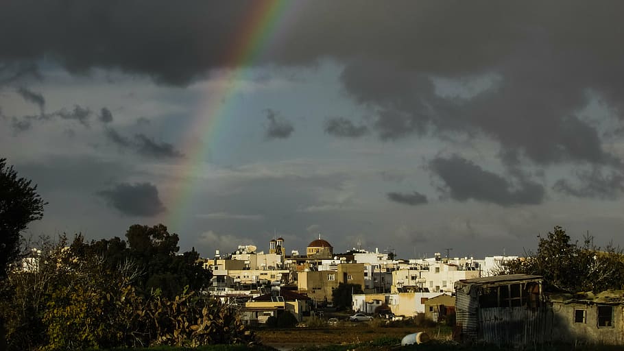 aerial photography of city buildings, rainbow, storm, town HD wallpaper
