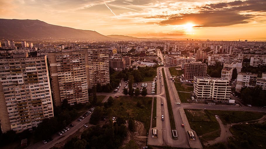 aerial photo of city under cloudy sky at sunset, high-rise building under white sky HD wallpaper