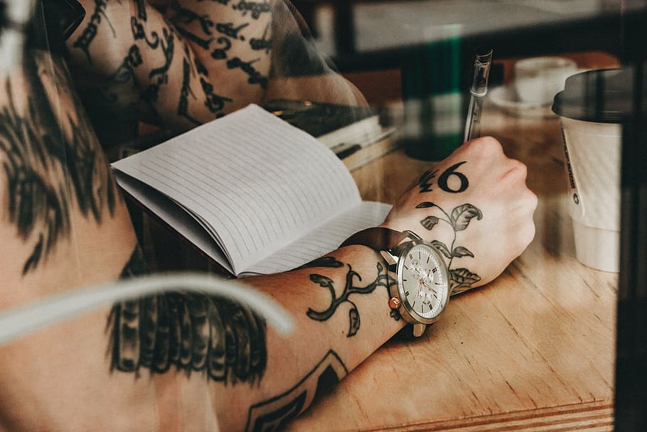person writing on ruled paper, people, man, reading, book, wooden HD wallpaper