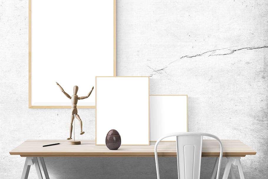white framed and action figure on table, poster mockup, template HD wallpaper