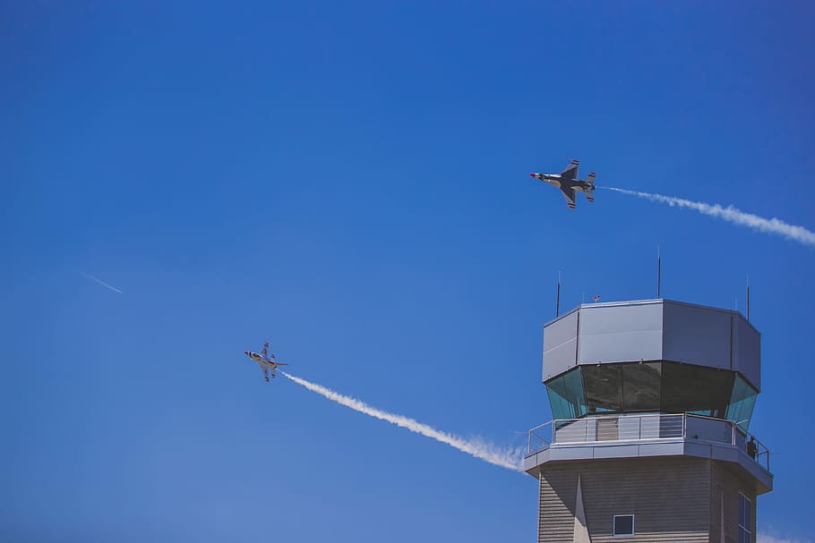 two jet planes flying over gray building during daytime, two planes flying on air HD wallpaper