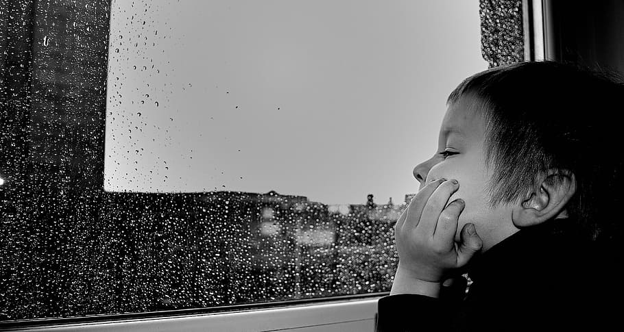 grayscale photography of boy watching the rain on window, children HD wallpaper