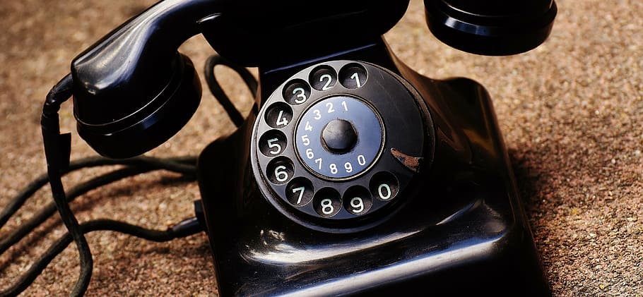 black rotary telephone, old, year built 1955, bakelite, post