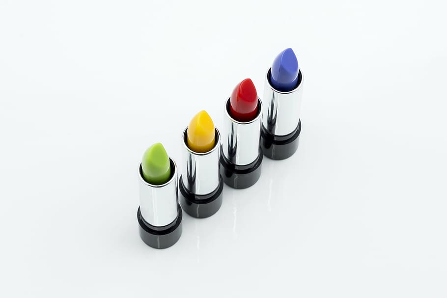 macro shot of four lipsticks bottle, make up, cosmetics, white background HD wallpaper