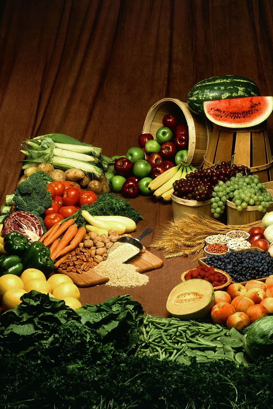 variety of fruits and vegetables on top of wooden table, healthy eating