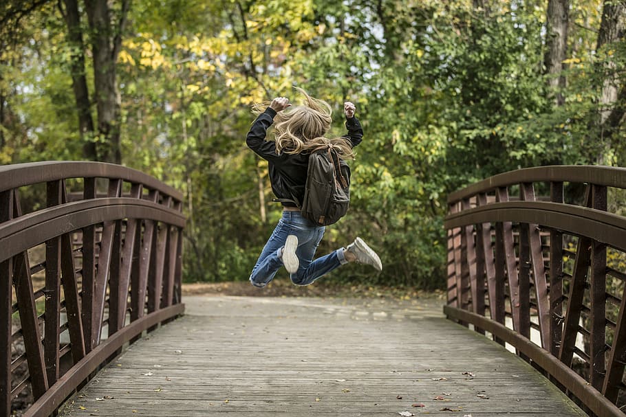 girl jump shot photo on brown wooden bridge, blond, blonde, fun, HD wallpaper