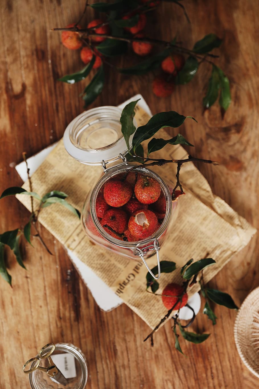 flat lay photography of jar of red fruits, round red fruits in a jar on top of table HD wallpaper