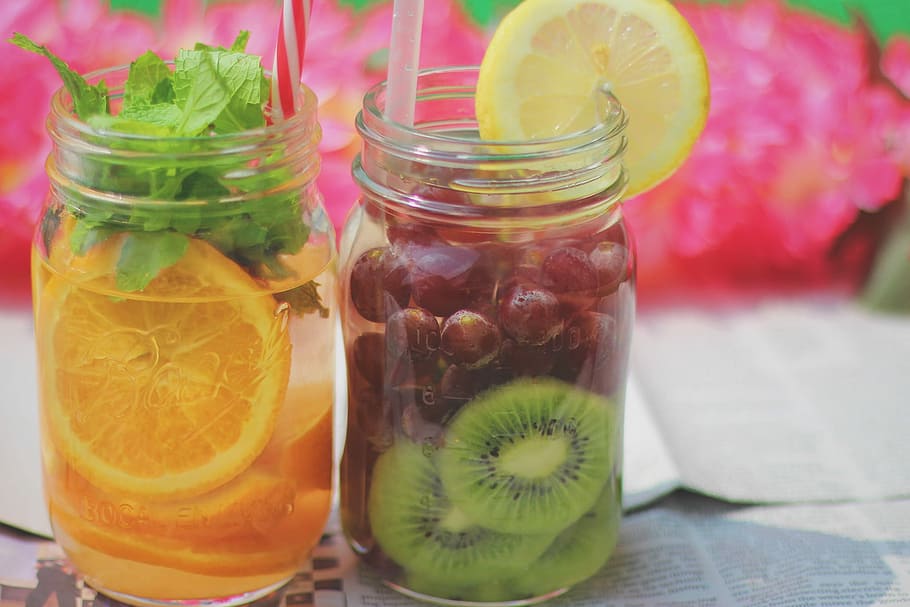 two clear glass jars with orange and grapes fruits juices, food HD wallpaper