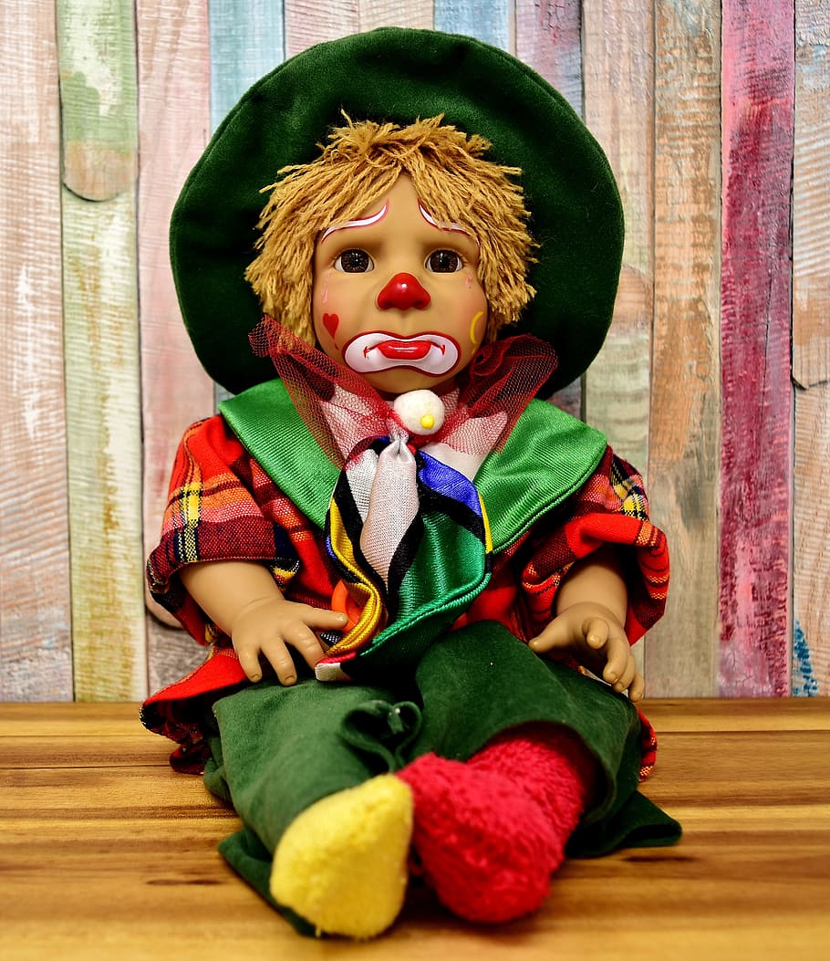jester boy with green hat doll, clown, cute, sad, children, colorful