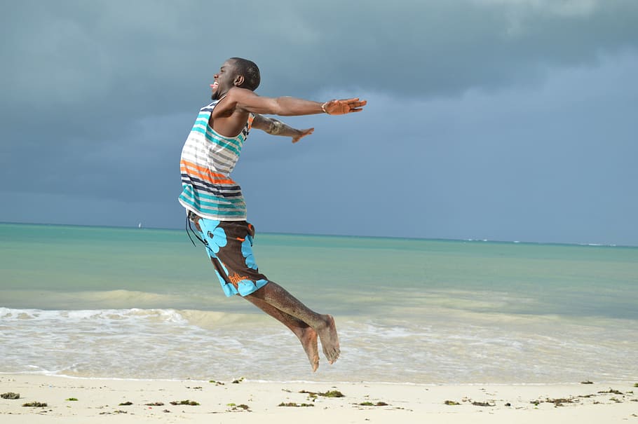 man jumping on beach shore, water, summer, vacation, sea, ocean HD wallpaper
