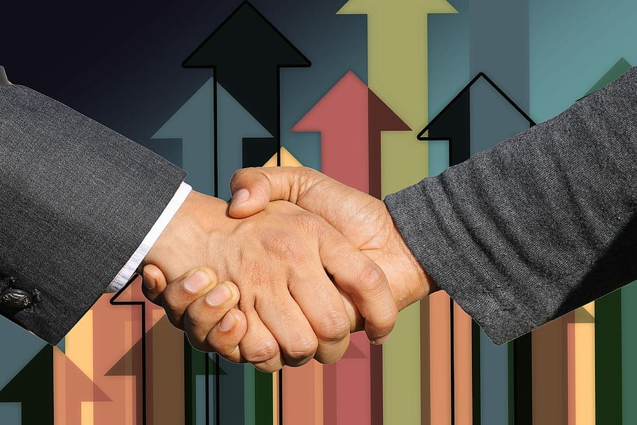 Handshake two men in honor new partnership Vector Image