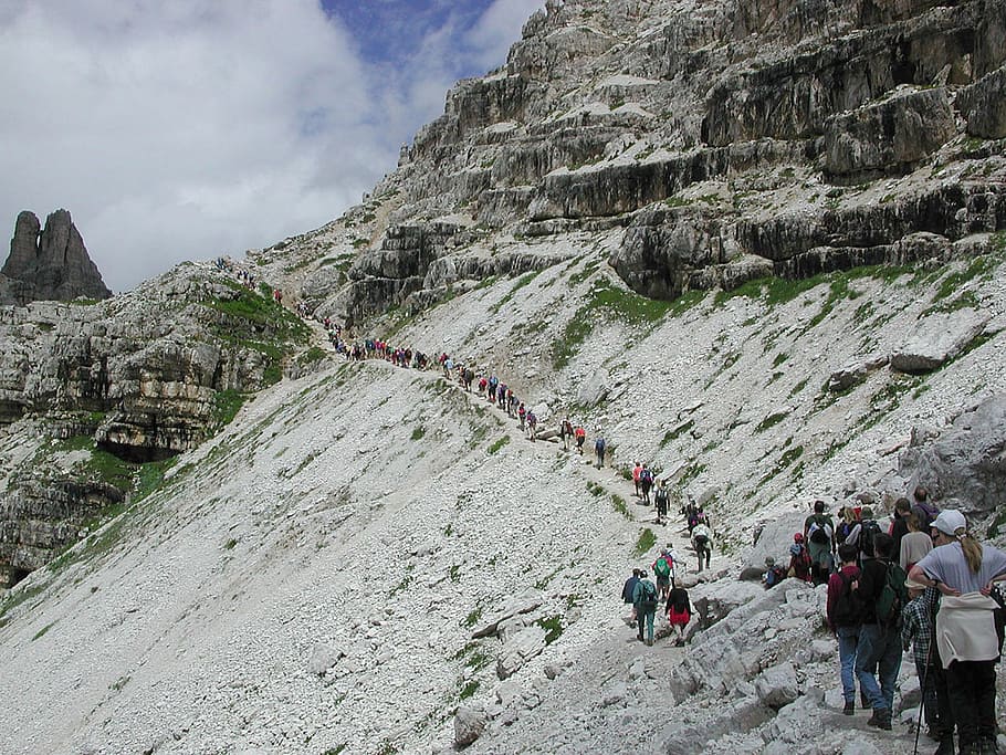 group of people climbing mountain, three zinnen, trail, hike
