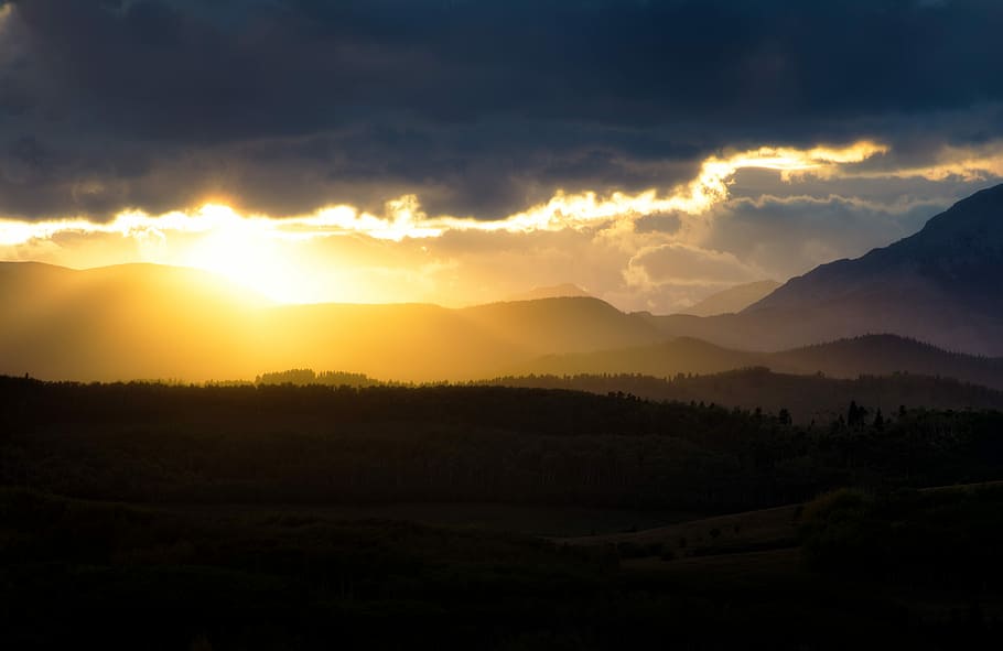 silhouette of trees during sunset, sun covered with clouds, mountain HD wallpaper