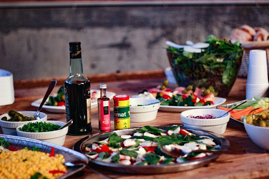 vegetables on plate beside bottle on table, bread, condiments HD wallpaper
