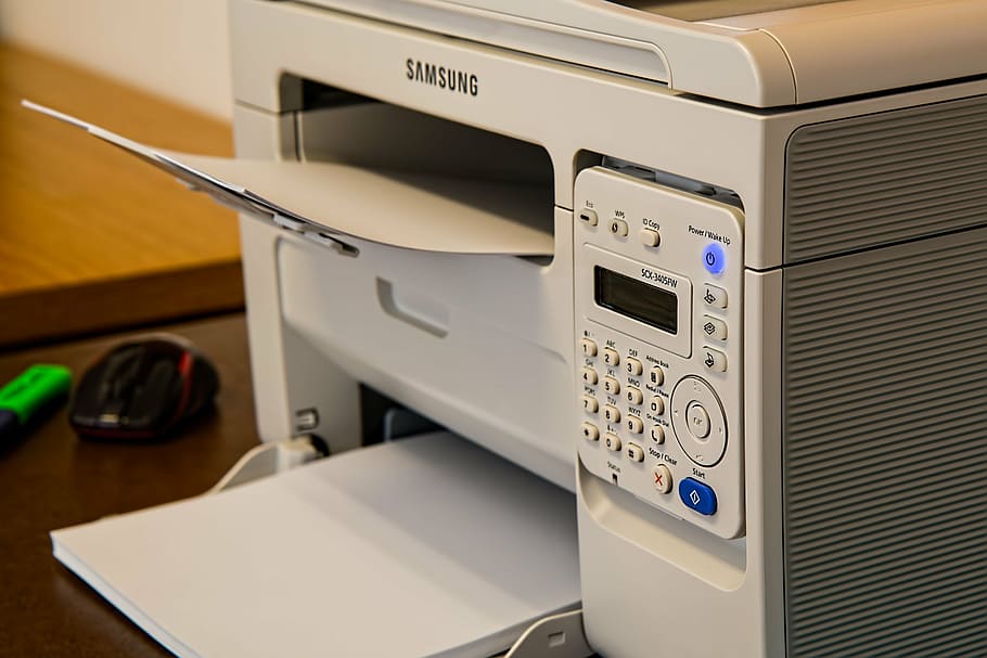 photo of white Samsung multi-function printer, desk, office, fax