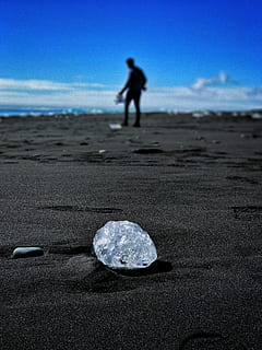 round clear gem stone on ground, grey stone on sand, ice, beach HD wallpaper