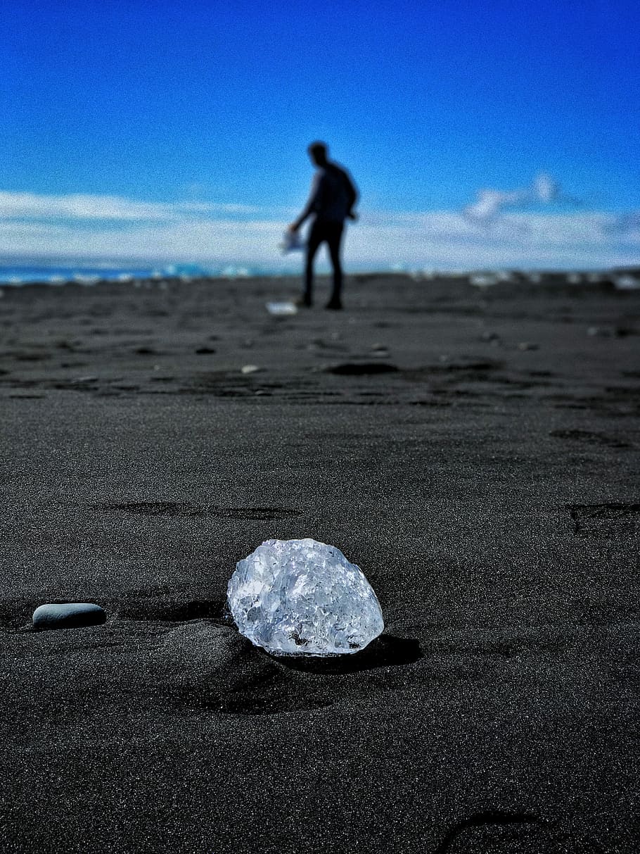 round clear gem stone on ground, grey stone on sand, ice, beach HD wallpaper