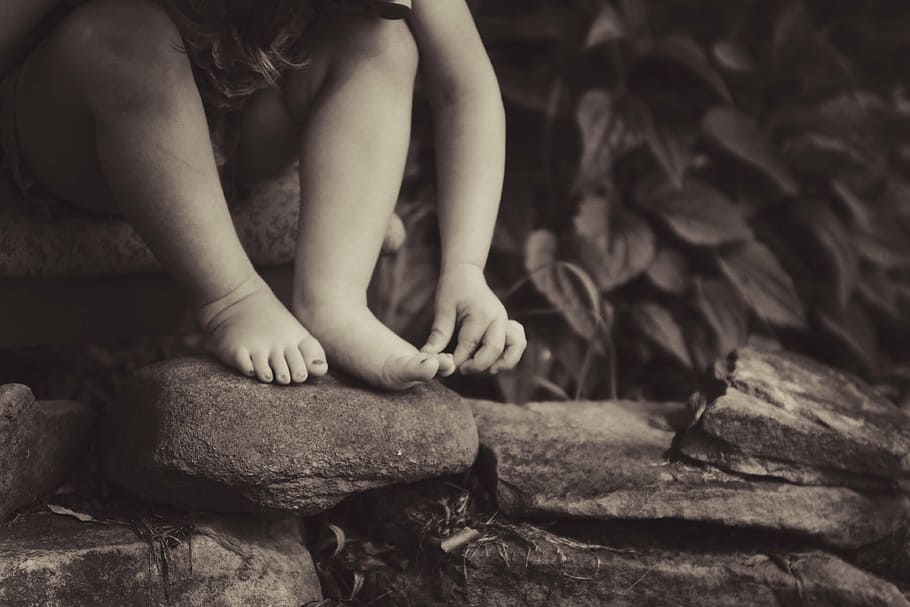 toddler sitting on brown rock, rocks, people, kid, child, nature HD wallpaper