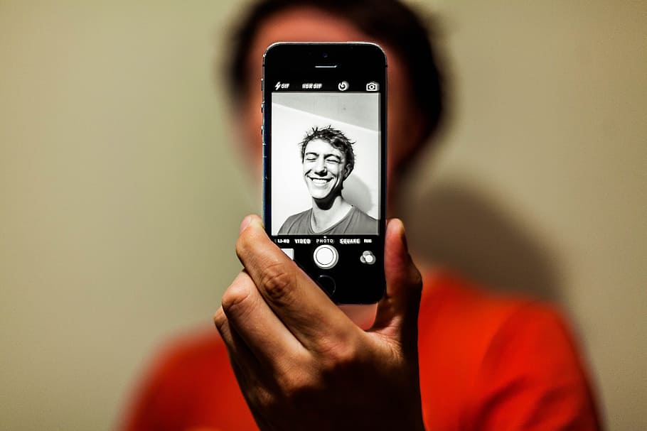 Man in Red Shirt Having Selfie on His Iphone in Grayscale Mode, HD wallpaper