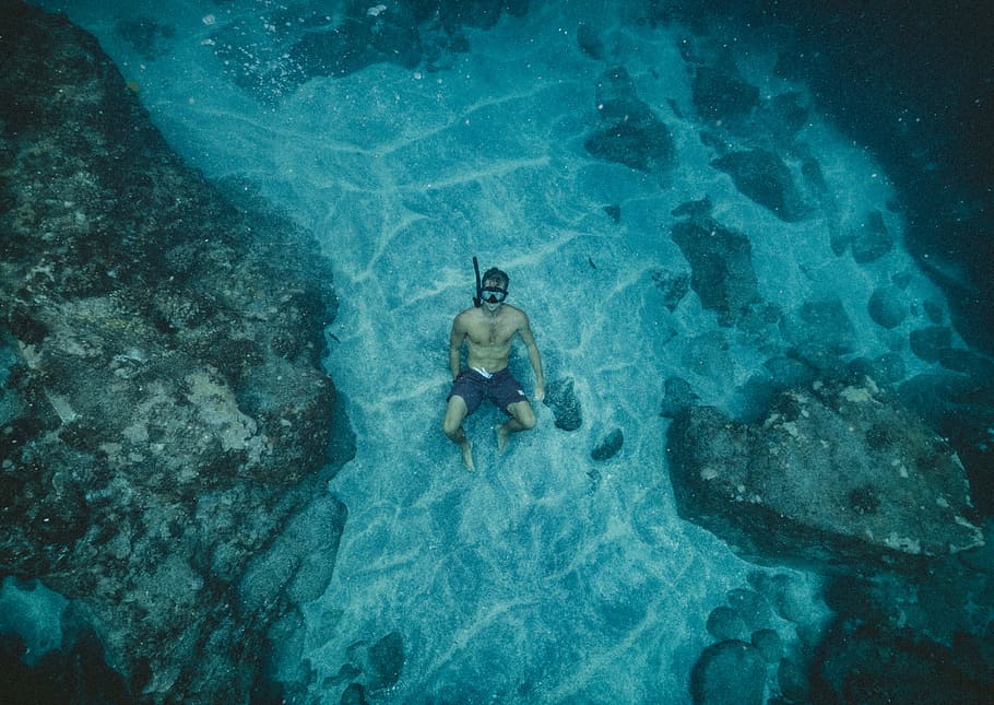 man in black shorts wearing snorkel, men sitting on blue ocean HD wallpaper