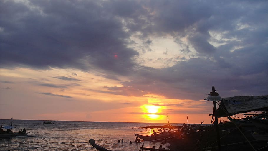 sunset, clouds, nature, cloudy, sunlight, sun rays, boat, people HD wallpaper