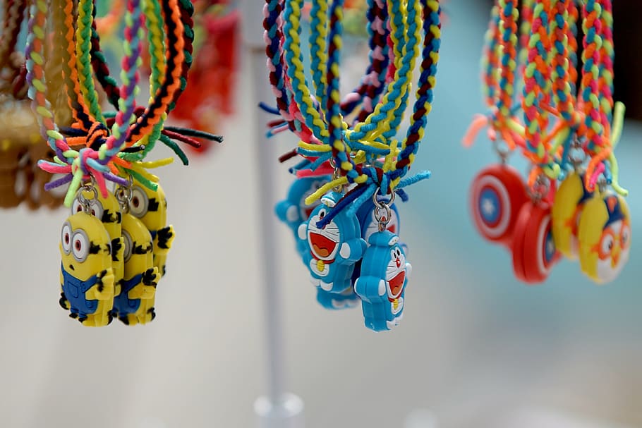 braids, bracelet, doll, hanging, multi colored, focus on foreground HD wallpaper