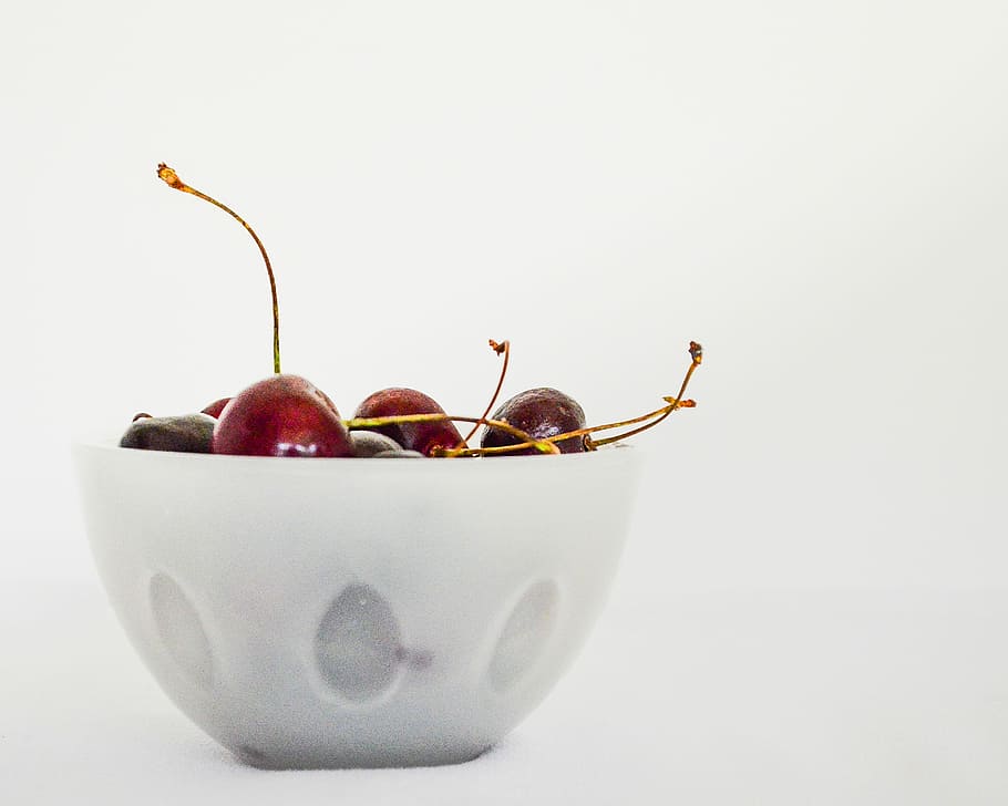 red cherries in white ceramic bowl, clear glass bowl filled with cherries HD wallpaper